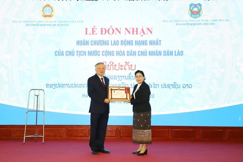 TANDTC Việt Nam đón nhận Huân chương Lao động hạng Nhất của Chủ tịch nước CHDCND Lào