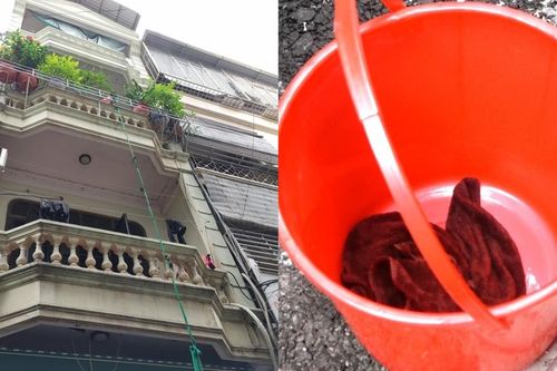 Cháu bé 5 tháng tuổi được cho vào xô thả xuống thoát khỏi đám cháy