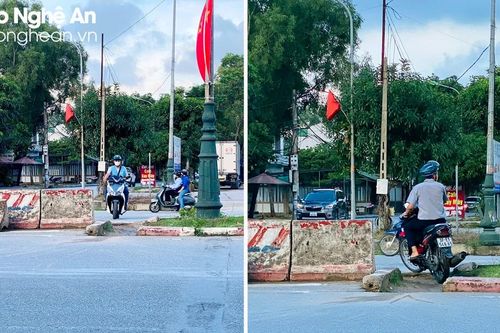 Người dân bất chấp nguy hiểm vượt rào chắn trên Đại lộ Lê Nin (TP. Vinh)