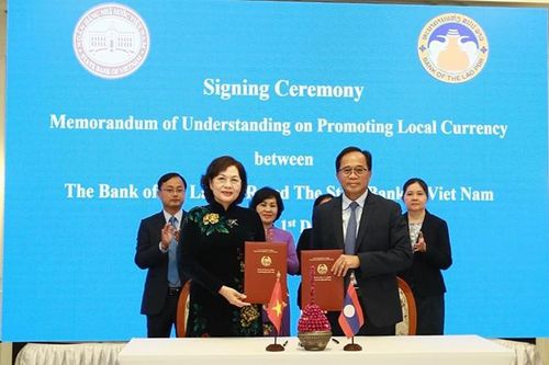 Việt Nam và Lào thúc đẩy thanh toán song phương bằng đồng nội tệ