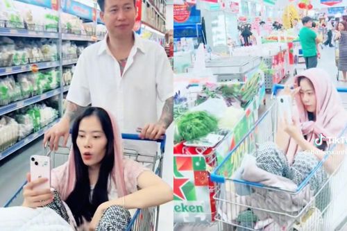 Nam Em vừa ngồi xe đẩy siêu thị, vừa livestream đôi co với người xem
