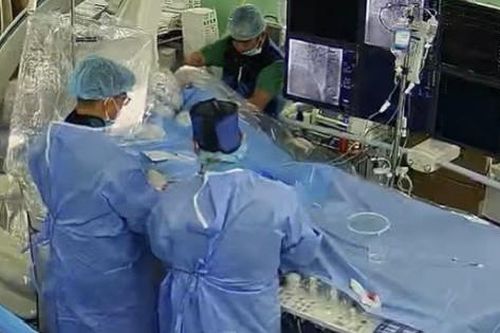 Hỗ trợ tuyến dưới kỹ thuật đóng thông liên nhĩ lỗ thứ phát bằng dụng cụ qua da