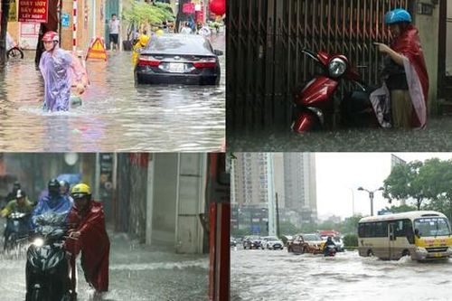 Mưa lớn khiến người và xe ở Hà Nội 'bơi' trên phố