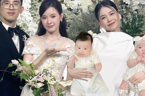Fan thích thú hình ảnh 'một nách 2 con' của Sam tại đám cưới Midu