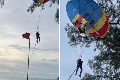 Du khách mắc kẹt trên cây vì trời chuyển gió đột ngột khi chơi dù lượn ở Thái Lan