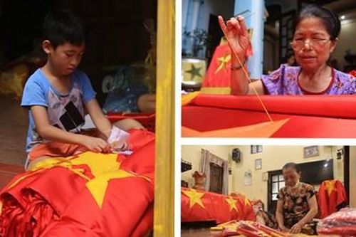 Rực rỡ sắc đỏ tại ngôi làng gần 80 năm giữ nghề may cờ Tổ quốc