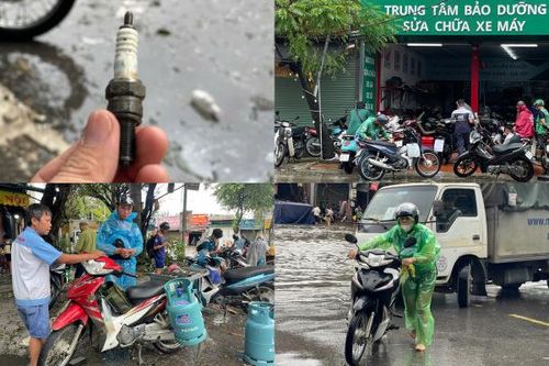 Mưa lớn, thợ sửa xe máy Hà Nội kiếm tiền triệu ở những điểm ngập lụt