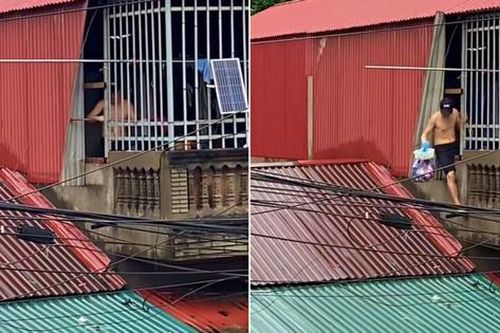 Xúc động hình ảnh người đàn ông bất chấp nguy hiểm tiếp tế thực phẩm cho hàng xóm giữa nước lũ