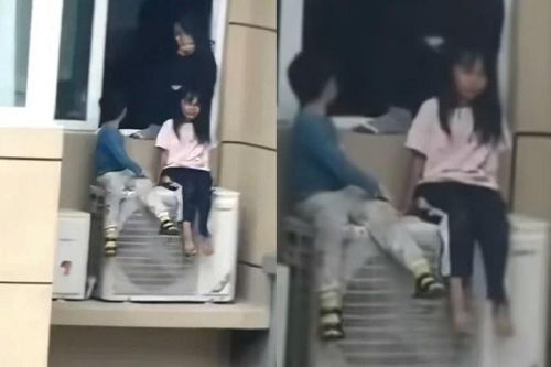 Người mẹ bắt hai con ngồi ngoài cục nóng điều hòa để chọc tức chồng