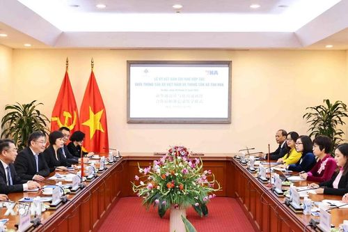 Thông tấn xã Việt Nam và Tân Hoa xã tăng cường hợp tác thông tin