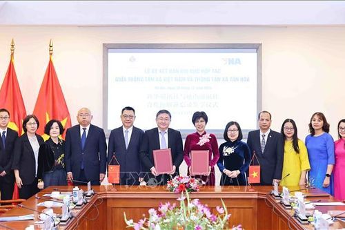 Thông tấn xã Việt Nam và Tân Hoa xã tăng cường hợp tác thông tin