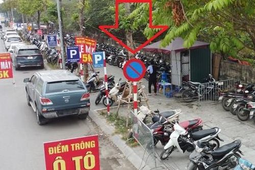 Bãi xe quanh Bệnh viện K Tân Triều trưng biển 'có phép' nhưng thu phí 'vô phép'