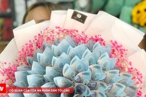 Dùng tiền polymer làm thành bó hoa có vi phạm pháp luật?