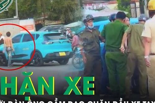 Khống chế người đàn ông cởi trần cầm dao chặn xe taxi tìm vợ