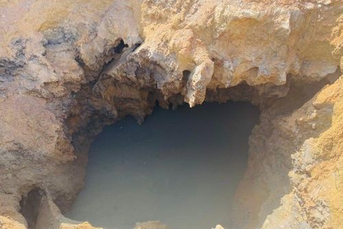 Dừng hút nước, mở rộng phạm vi tìm kiếm nạn nhân mất tích ở 'hố tử thần'