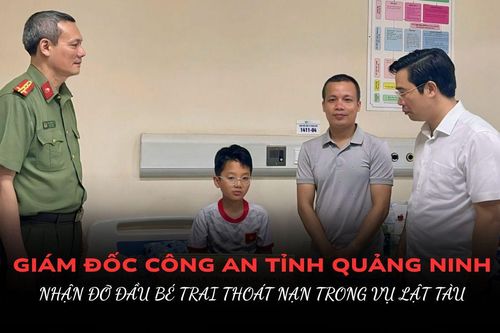 Giám đốc Công an tỉnh Quảng Ninh nhận đỡ đầu bé trai sống sót trong vụ lật tàu trên vịnh Hạ Long
