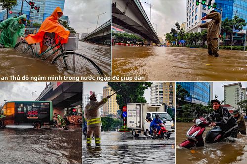 Hình ảnh chiến sỹ Công an Thủ đô ngâm mình trong nước ngập để giúp dân