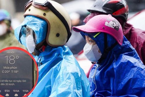 Người Hà Nội co ro trong mưa lạnh 18°C sáng đầu tuần