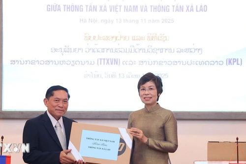 Tổng giám đốc TTXVN Vũ Việt Trang hội đàm với Tổng giám đốc TTX Pathet Lào