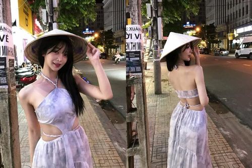 Hot girl xứ Hàn thích thú đội nón lá dạo đường phố khi du lịch Việt Nam
