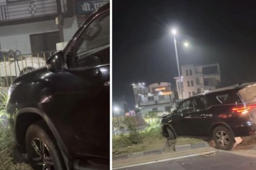 Tài xế Fortuner cố leo dải phân cách rồi mắc kẹt giữa rãnh cống thoát nước