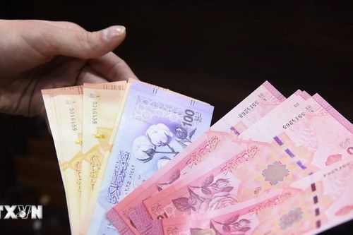 Syria bắt đầu đổi tiền sau khủng hoảng do xung đột kéo dài
