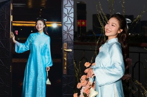 'Boxing girl' Khả Ngân dịu dàng bước vào 'đường đua áo dài' đón Tết