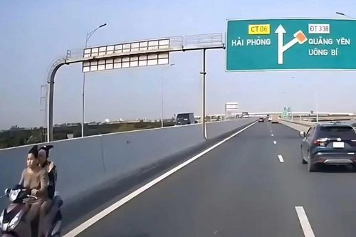 Xử phạt thiếu nữ không đội mũ bảo hiểm đi xe máy ngược chiều vào đường cao tốc