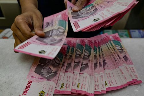 Nhà đầu tư ngoại ồ ạt bán tài sản Indonesia