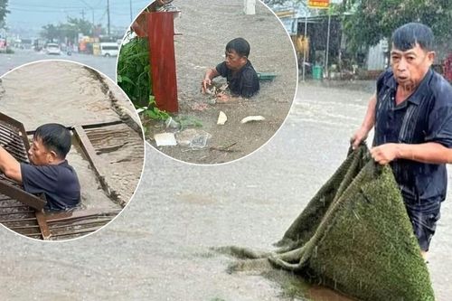 Nước ngập gần 1m, trưởng thôn ngụp xuống cống vớt rác giữa mưa lớn