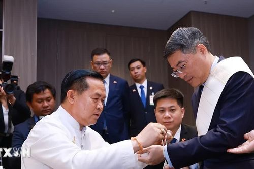 Thủ tướng Lê Minh Hưng dự Lễ buộc chỉ cổ tay truyền thống của Lào