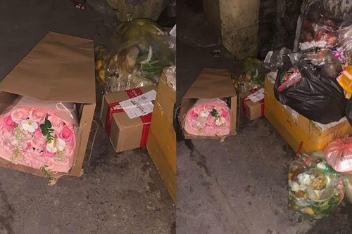 Cảnh những bó hoa đẹp bị vứt bãi rác sau 20/10 gây tranh cãi về sự lãng phí