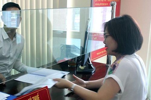 Thí điểm nộp lệ phí trước bạ điện tử đối với ô tô, xe máy tại Hà Nội và TP Hồ Chí Minh