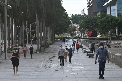 Sống chung an toàn với COVID-19: Singapore để ngỏ khả năng trì hoãn việc nới lỏng giãn cách