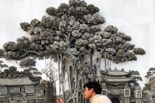 Từ cát và xi măng, chàng họa sĩ làm nên tuyệt tác trên bức tường khiến dân mạng trầm trồ