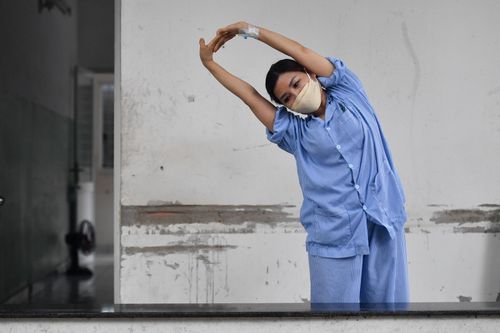 Bốn triệu chứng người dân cần đi khám hậu Covid-19