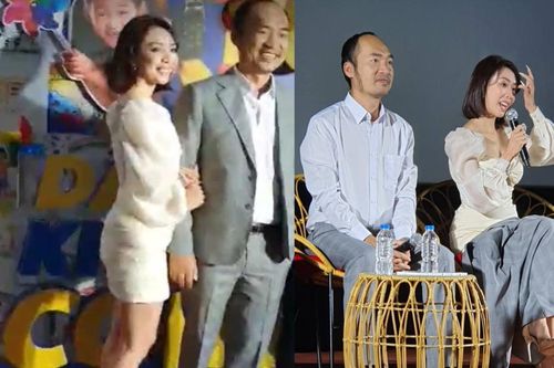 Tiến Luật cởi áo đưa bà xã che chắn vì sợ bị 'lộ hàng', Thu Trang gây chú ý khi mang dép lê đi sự kiện