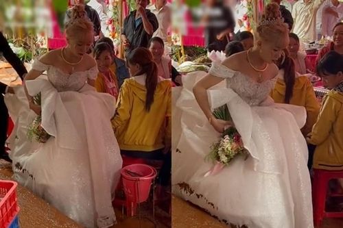 Đám cưới mùa mưa, cô dâu khổ sở 'bồng váy' về nhà chồng
