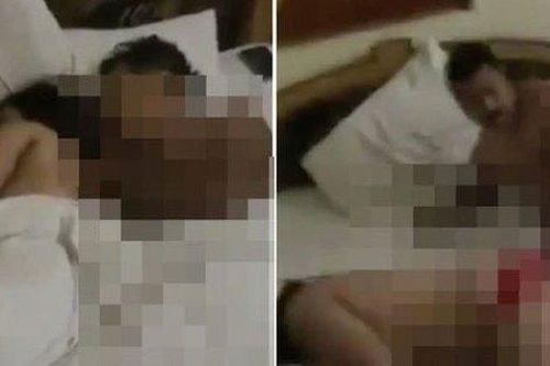 Vợ bước vào phòng khách sạn kéo chăn ra, bên dưới là chồng và người tình đang 'trần như nhộng'