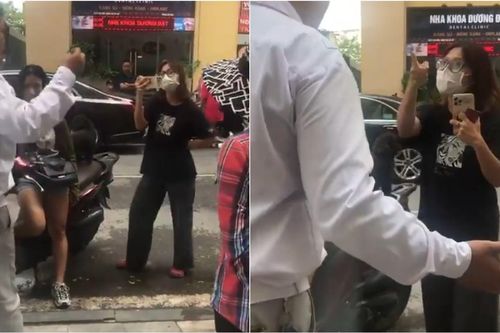 Cô gái dắt chó đi vệ sinh, bị nhắc nhở lại cãi lao công, chỉ thẳng tay vào mặt bảo vệ quát 'im mồm'
