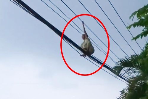 Giải cứu người phụ nữ đi trên đường dây điện ở Bình Dương