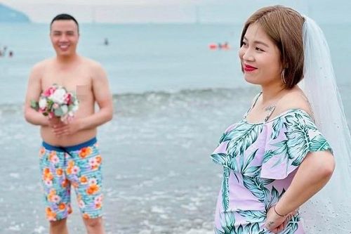Bà bầu Hoàng Linh chụp ảnh cưới với đồ tắm, khoe hình xăm 'khủng'
