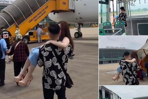 Cô gái đi cao gót được chồng bế lên máy bay, netizen tranh cãi