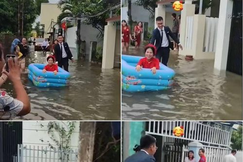 Đám cưới mùa lũ, cô dâu dùng phao bơi vượt qua đường ngập