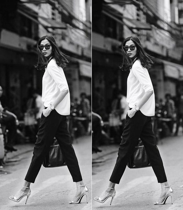 Hoàng Thùy toát lên vẻ đẹp sang trọng và quý phái với quần tây đen kết hợp áo trắng dáng thụng. Dép cao gót và túi xách rất thích hợp cho nàng công sở muốn khẳng định phong cách thời thượng.