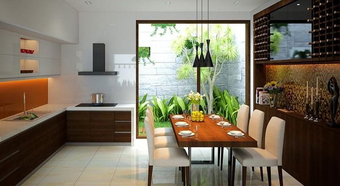 Phòng bếp và bàn ăn ấm cúng mở ra sân sau xanh mát. (Ảnh minh họa)