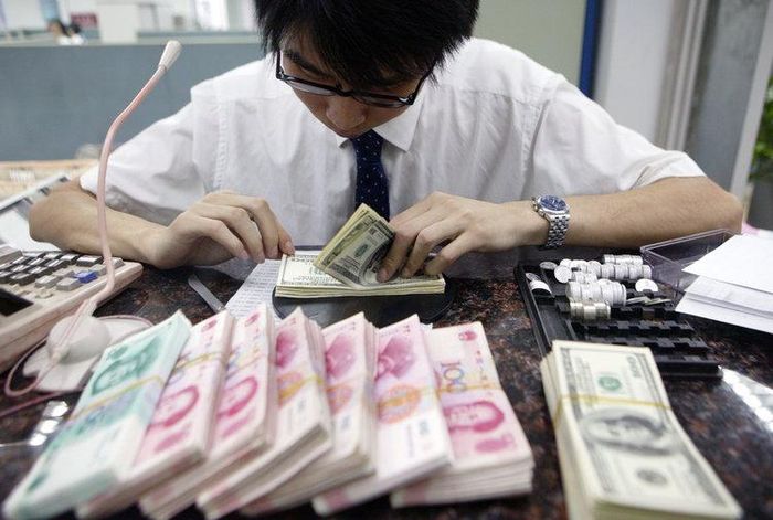 Trung Quốc cũng muốn giảm bớt vị thế của đồng đôla Mỹ và nâng cao sức mạnh đồng nhân dân tệ. Ảnh: Reuters