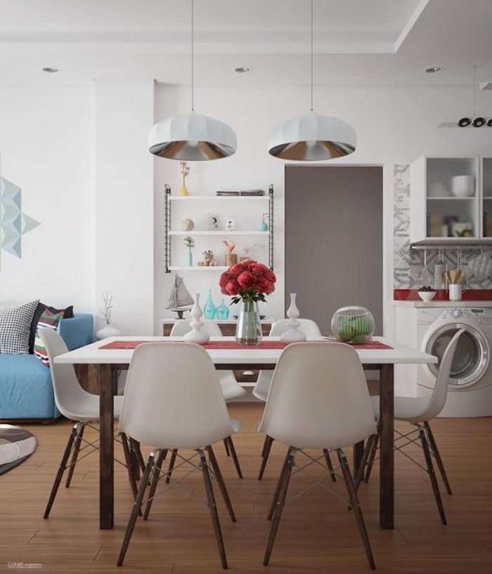 Hai chiếc đèn được treo từ trên trần nhà rủ xuống là điểm nhấn cho phòng ăn.