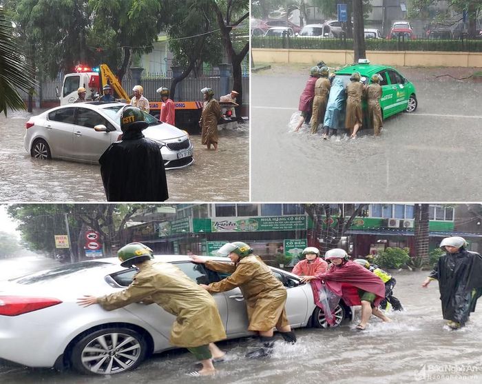 Một số phương tiện bị chết máy đã được các lực lượng chức năng TP.Vinh hỗ trợ di chuyển đến khu vực an toàn. Ảnh: Quỳnh Trang