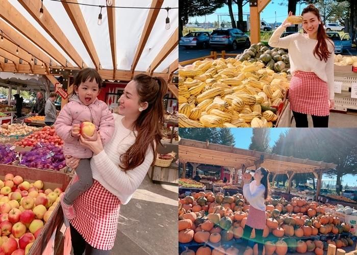 Á hậu Ngô Trà My cùng con gái vui vẻ chụp hình trong một phiên chợ tại Canada khi cô có chuyến nghỉ dưỡng tại đây.